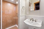 This bathroom with step in shower adjoins the 3rd bedroom